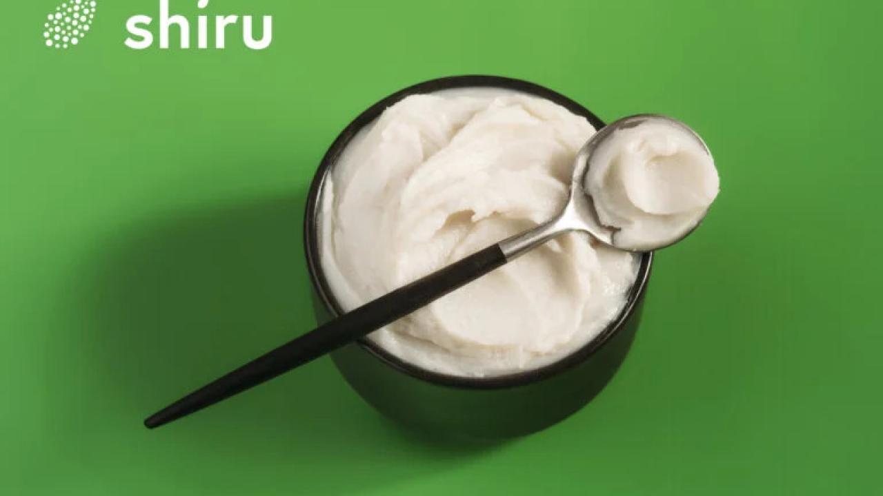 Shiru logo and a container and spoonful of the product.