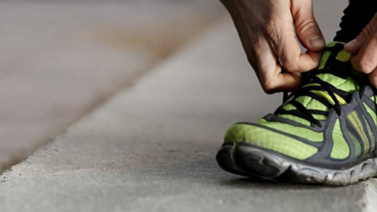 person tying their shoe