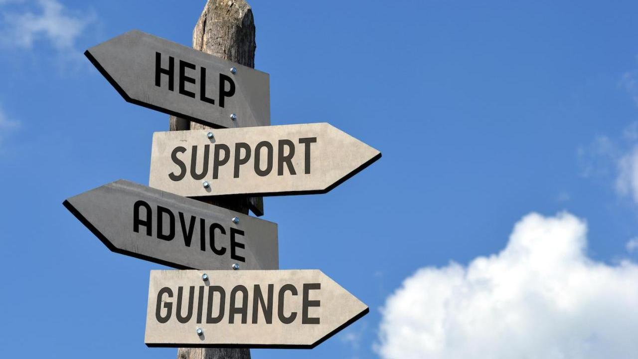 Signs with text "Help, Support, Advice, Guidance"