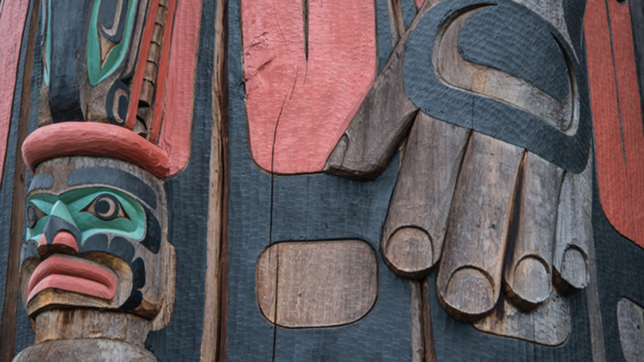 Detail of "Cedar Man Walking Out of the Log," a totem pole in Duncan, British Columbia. Carved by Gwe-la-y-gwe-la-gya-les (Richard Hunt), photo by Rex Wholster.