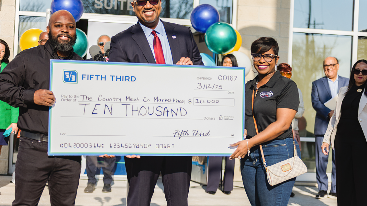 People holding an oversized check from Fifth Third