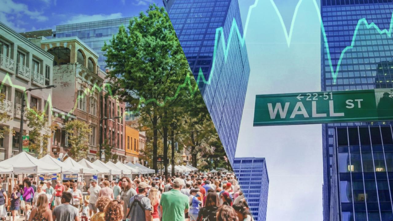 Wall Street sign and people in the street