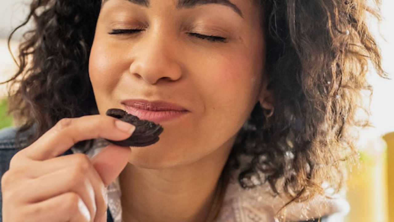 A person eating a biscuit