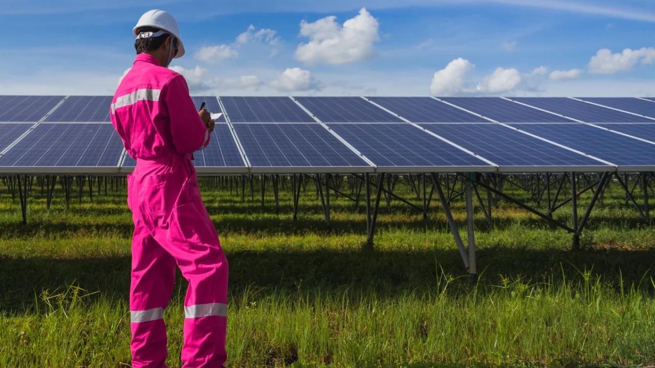 worker working on solar panels