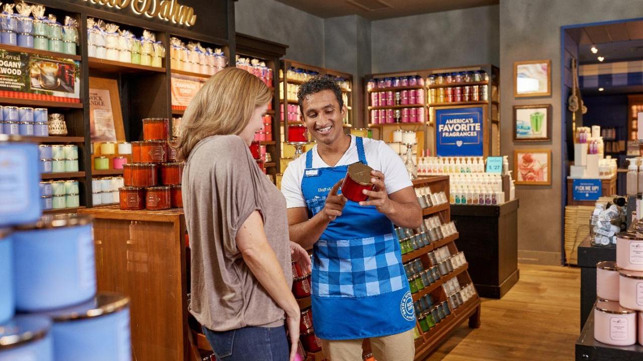 people looking at products in a Bath and Body Works store
