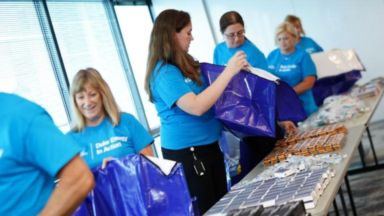 Duke Energy employee volunteers packing Storm kits 