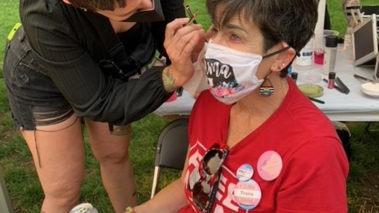 Person having makeup done by another