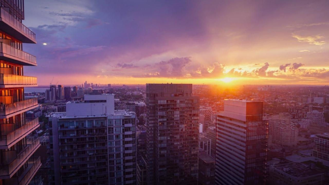 Sunsetting in the distance. A city landscape in front.