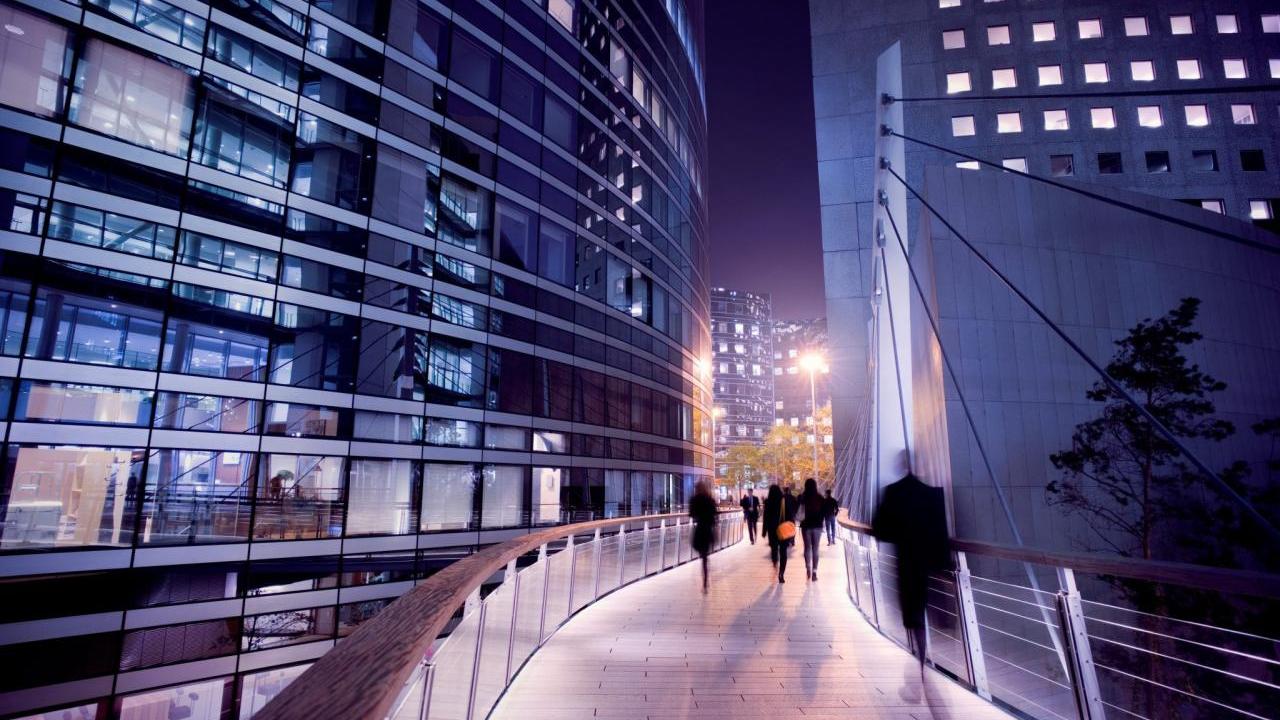 People walking in city at night