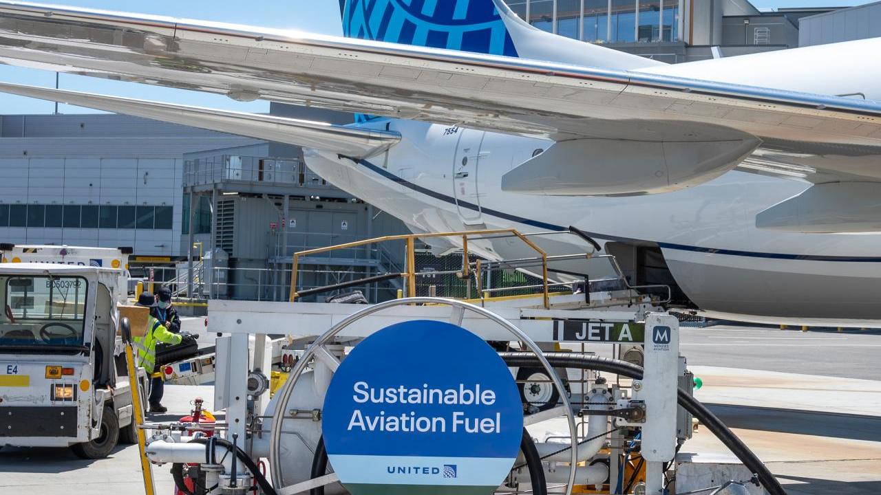 tank of sustainable aviation fuel refueling a United jet