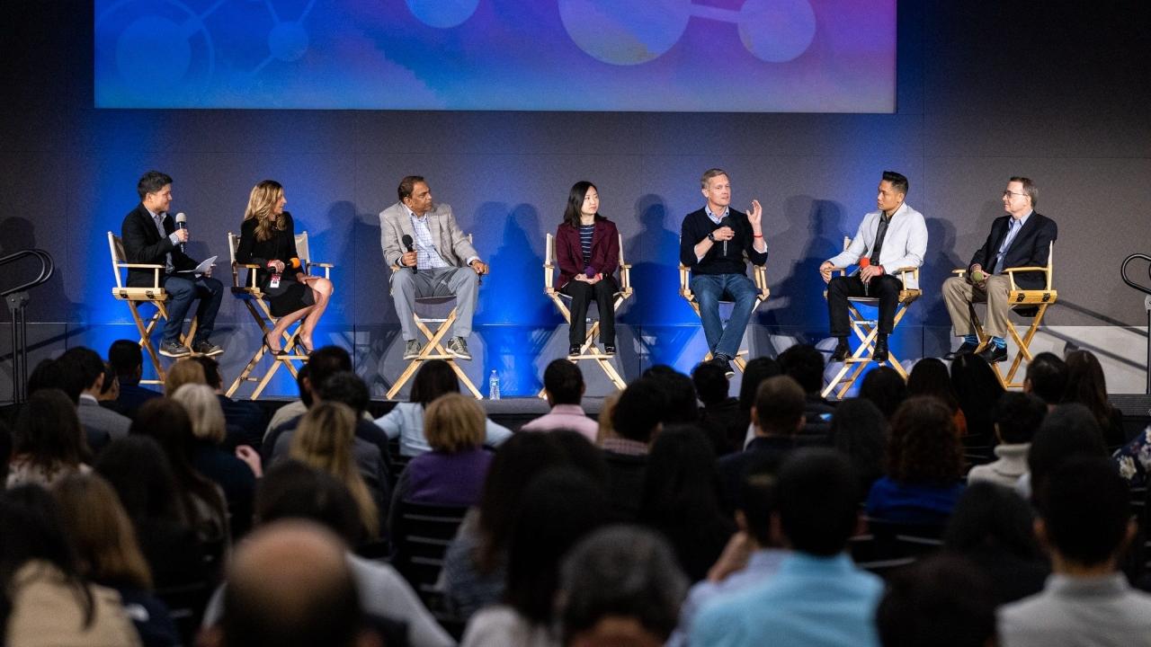 Panel on stage at Data Science Symposium