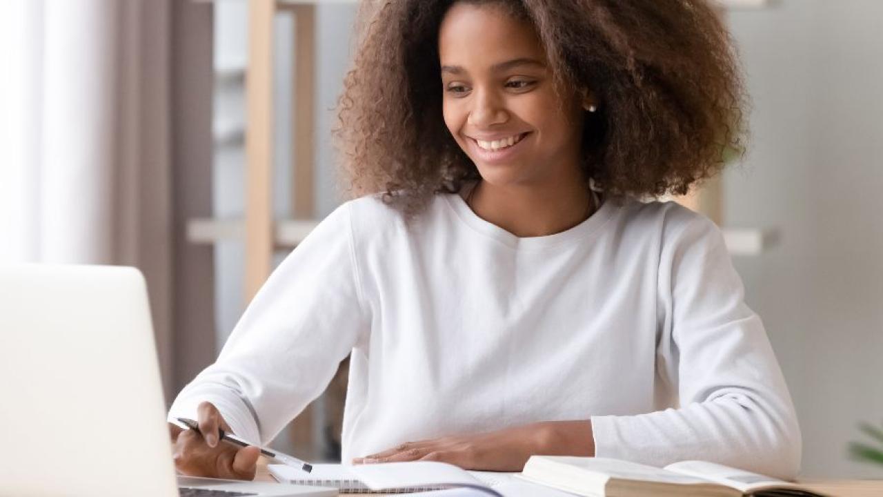 photo of young woman on a computer 