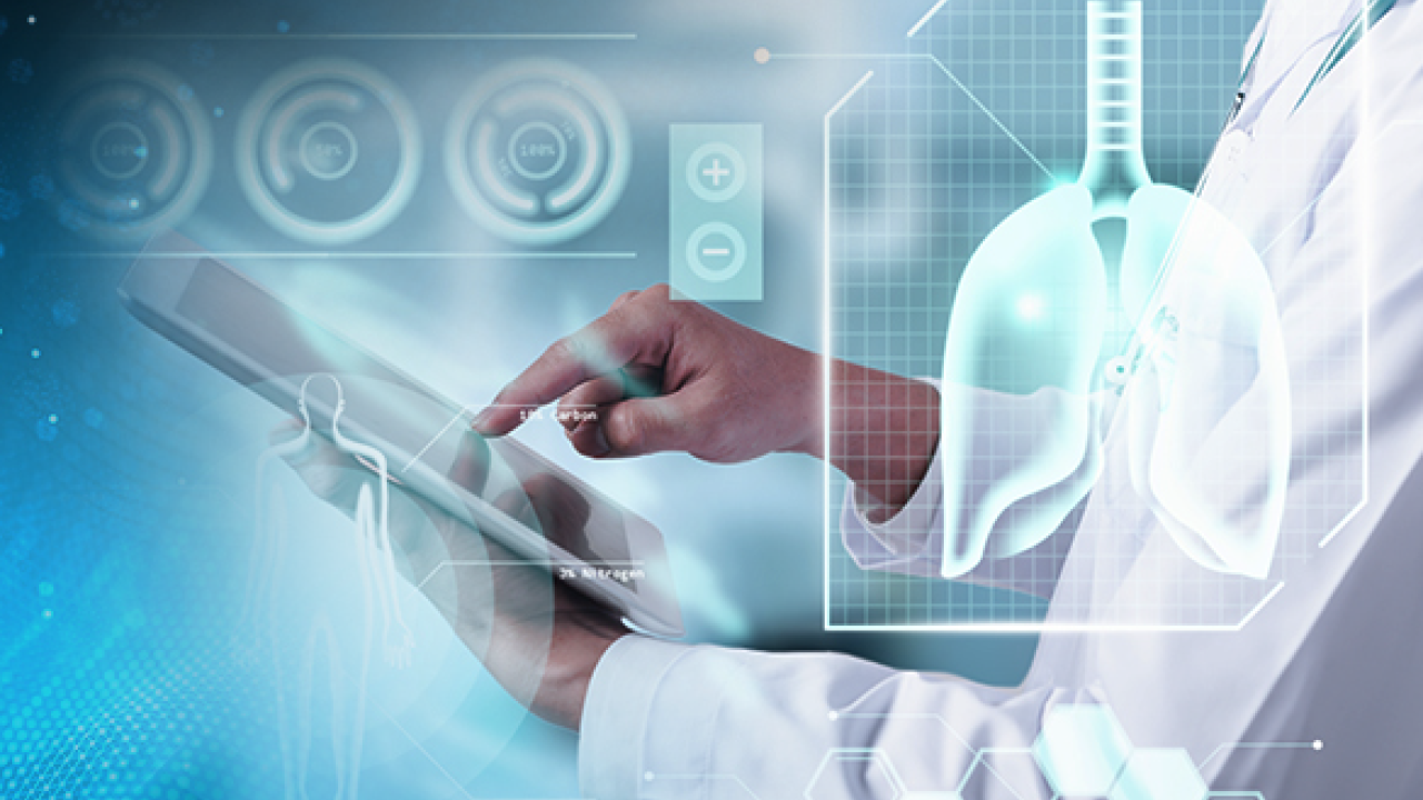 Finger on tablet with artistic medical overlays