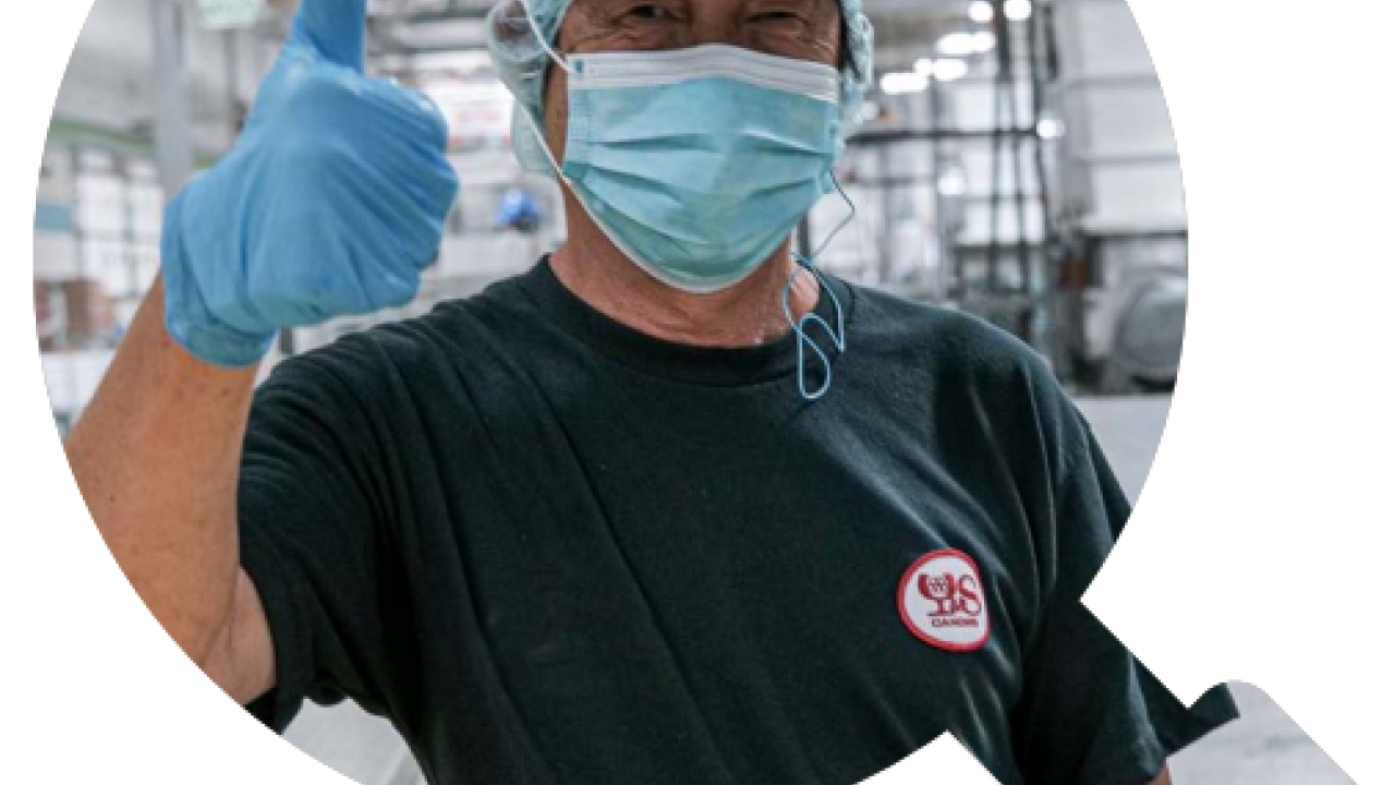 Person in safety gear giving thumbs up