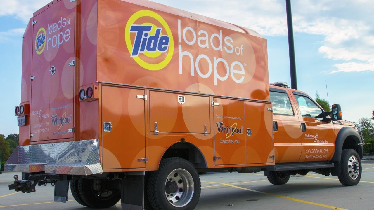 Orange truck and trailer, Tide Loads of Hope on the side