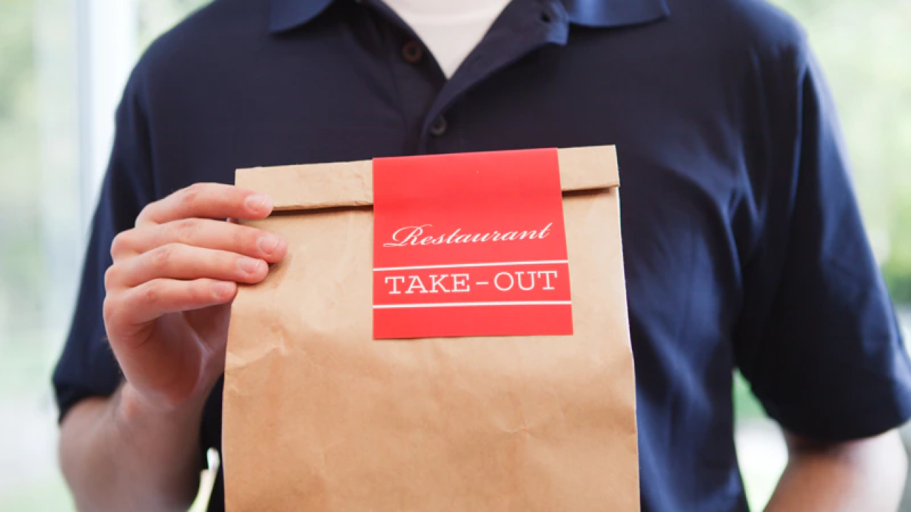 Person holding take-out order