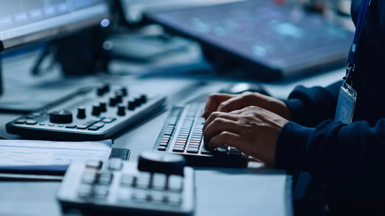 person typing at a computer