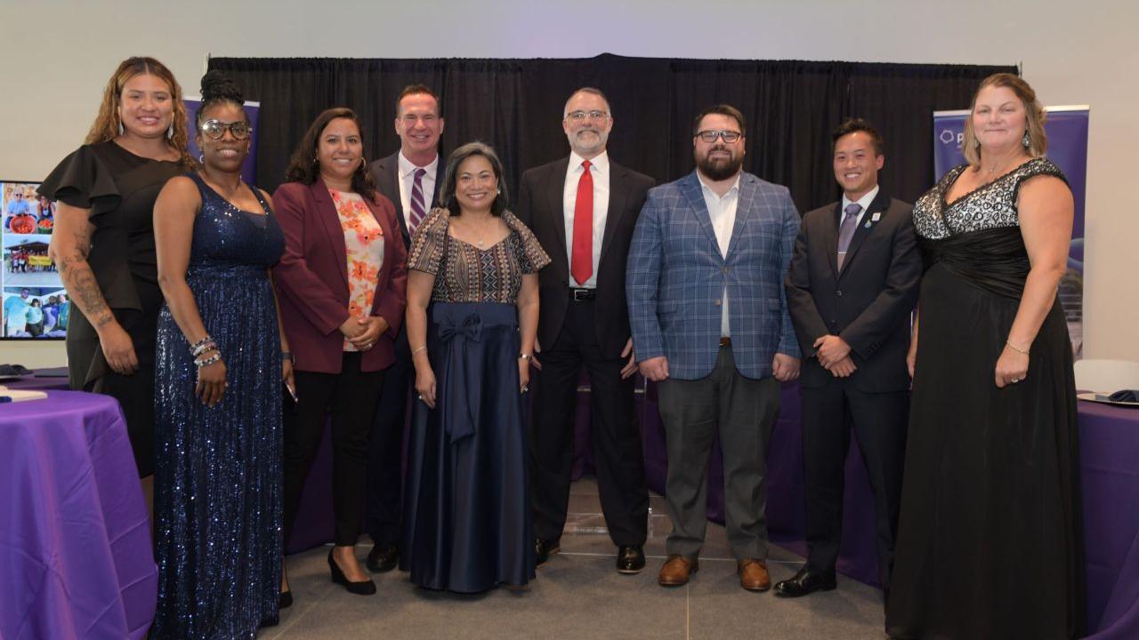 A group posed in formal attire
