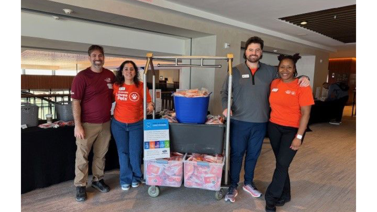 Volunteers with assembled pet adoption kits