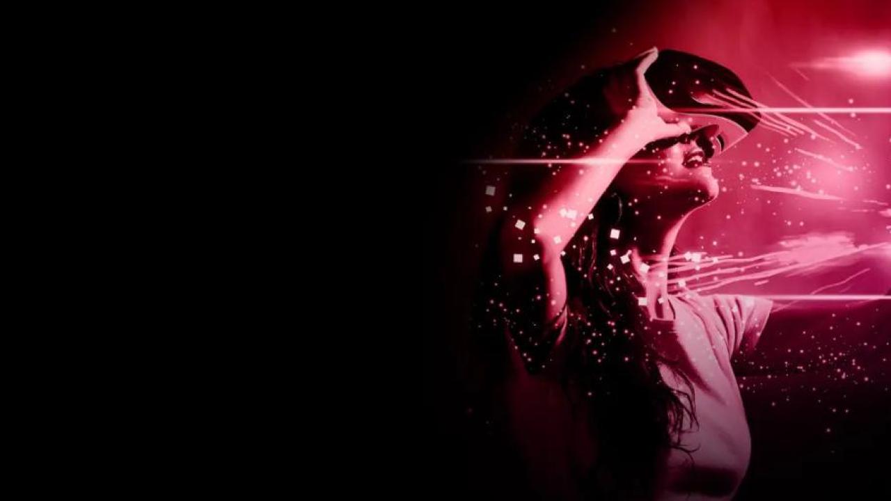 On a dark background a red digitized image of a person wearing a VR headset, reaching towards red lights.