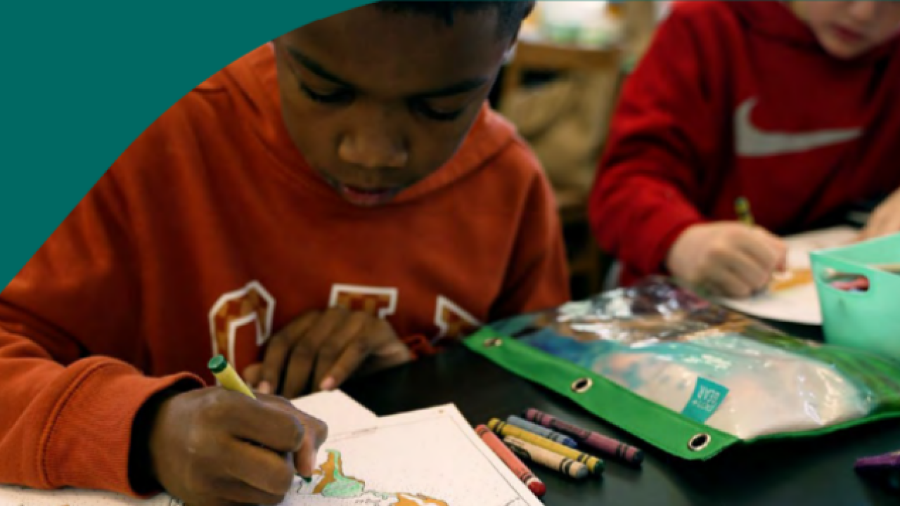Children coloring pages next to each other.