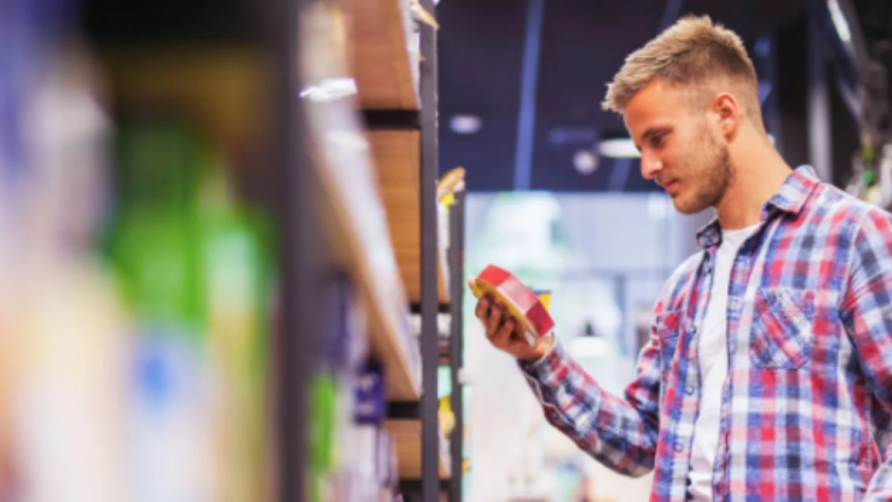 A customer looking at a product from a shelf