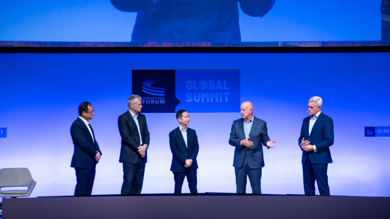 Five leaders in line on a stage