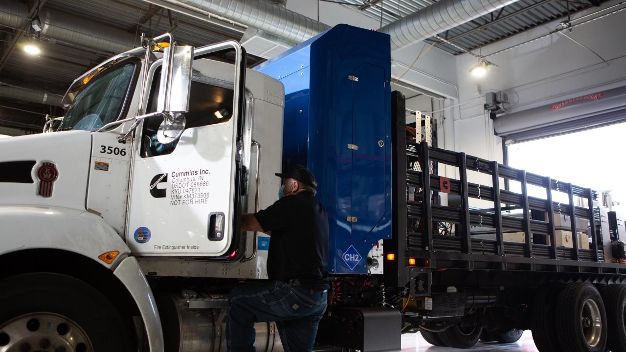 Cummins employee getting into hydrogen truck