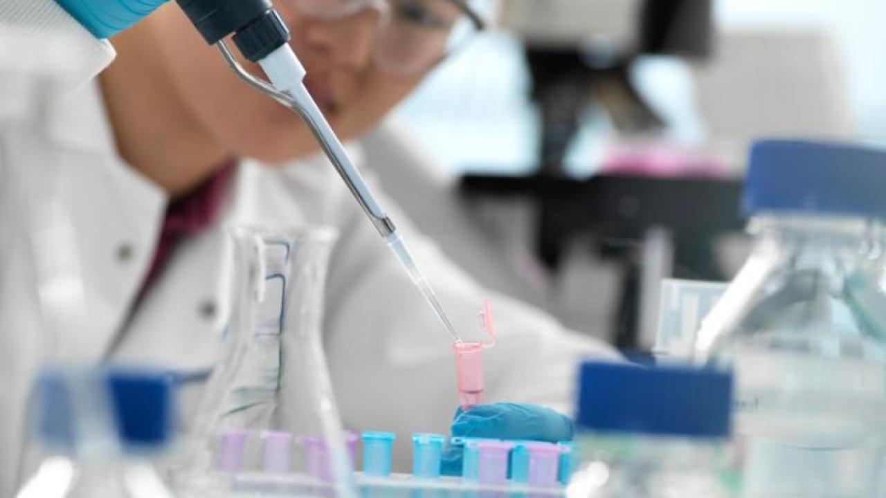 Illumina scientist shown working with samples.