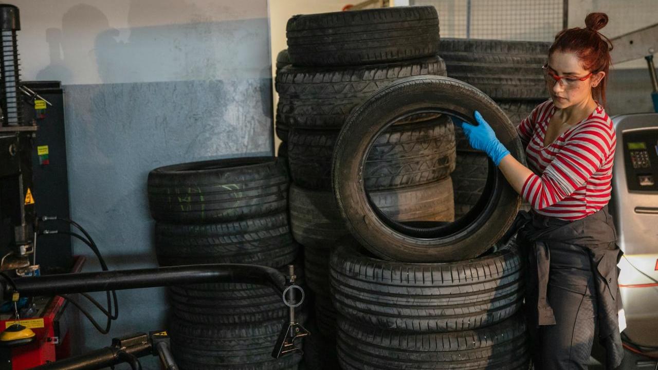Person stacking tires