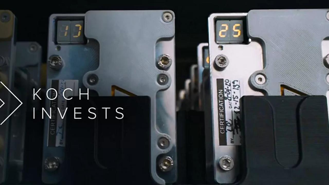 "Koch Invests" over rows of electronic components