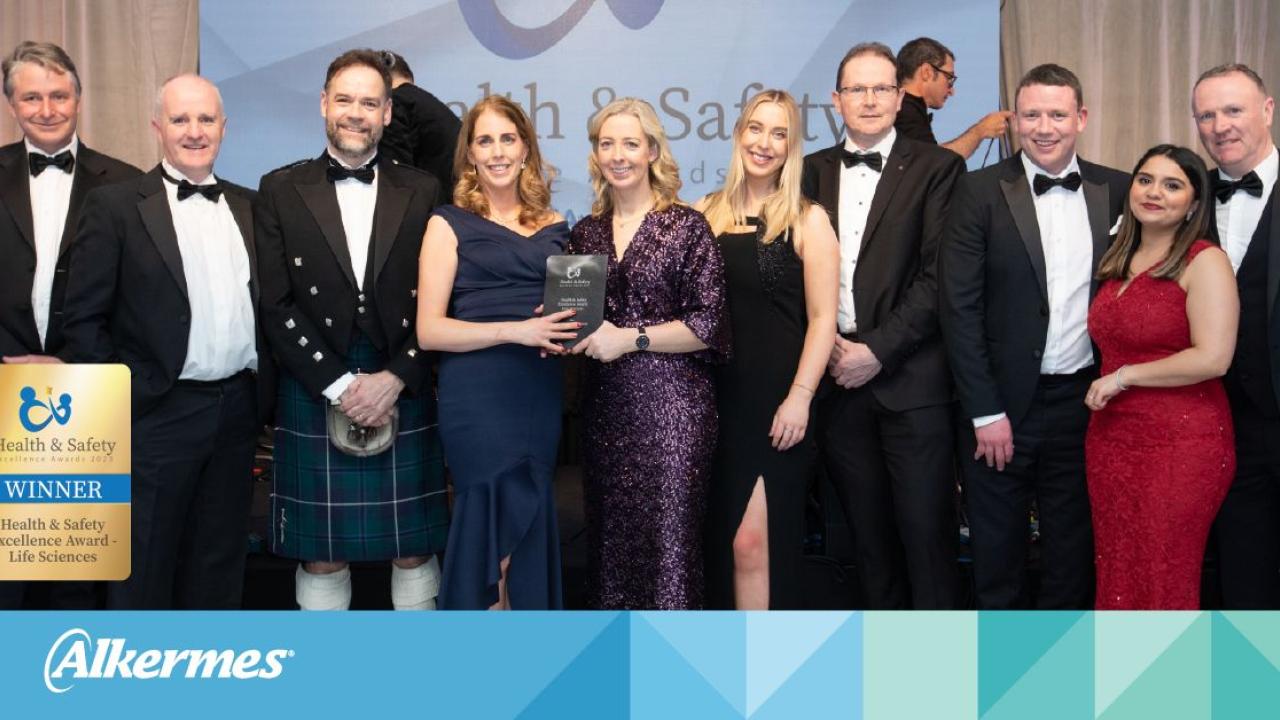 Group of people holding award