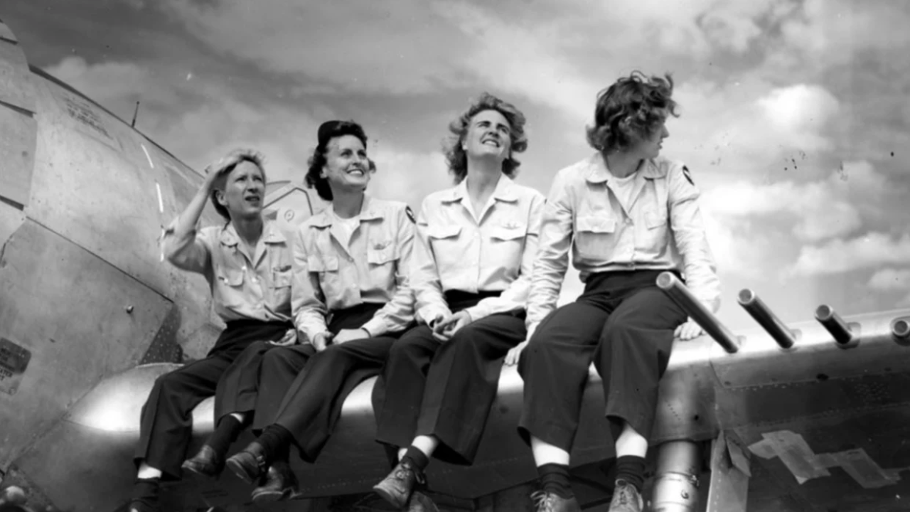 women pilots on wing of plane