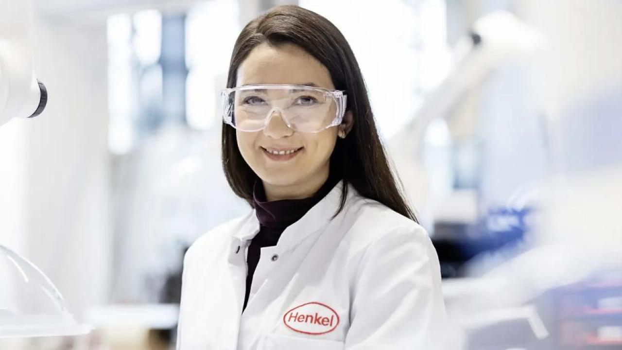 A person in protective lab wear in a laboratory setting
