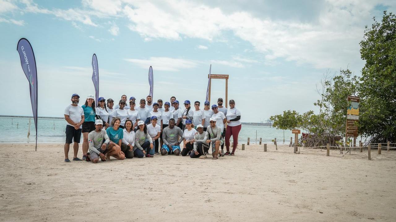 A group posed on a beach