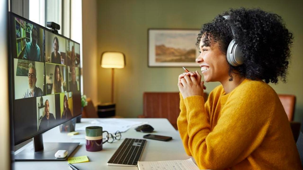 smiling person at a desk