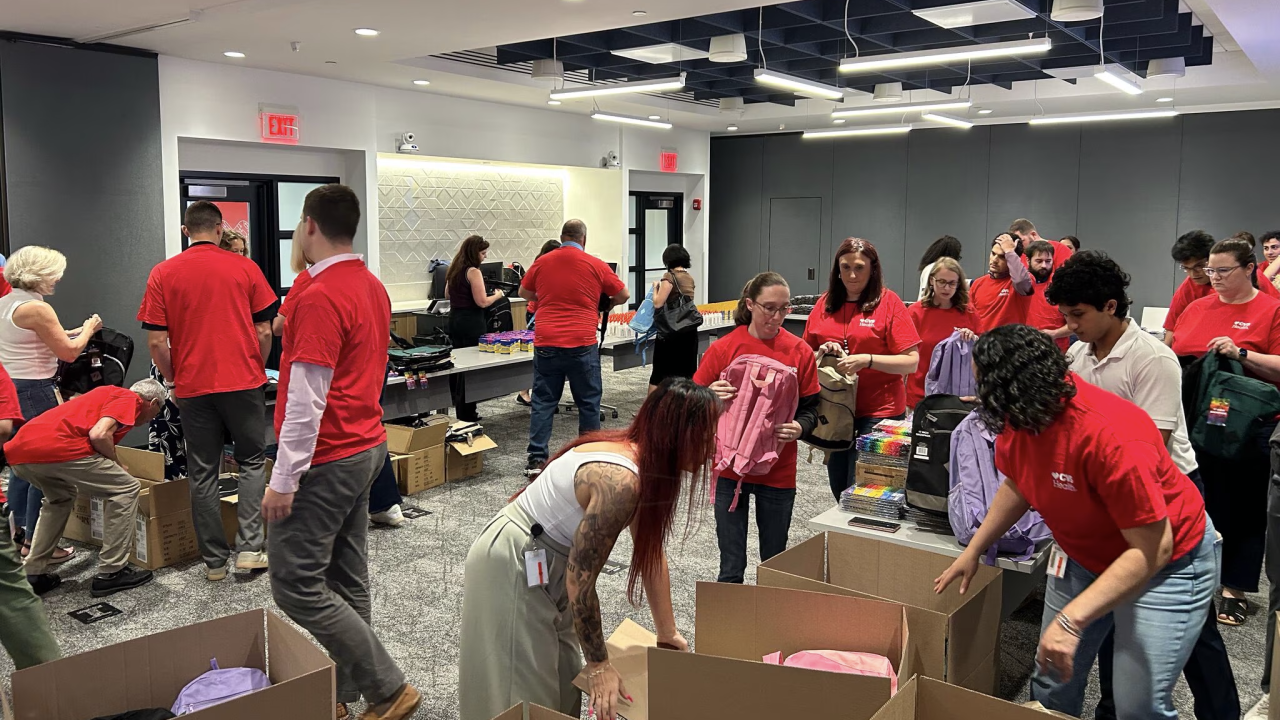 volunteers at back to school event