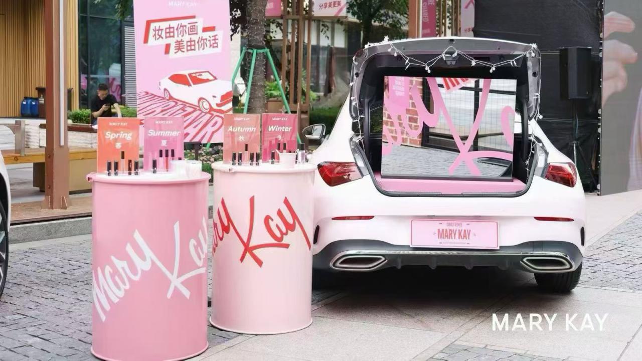 cosmetics display next to a car