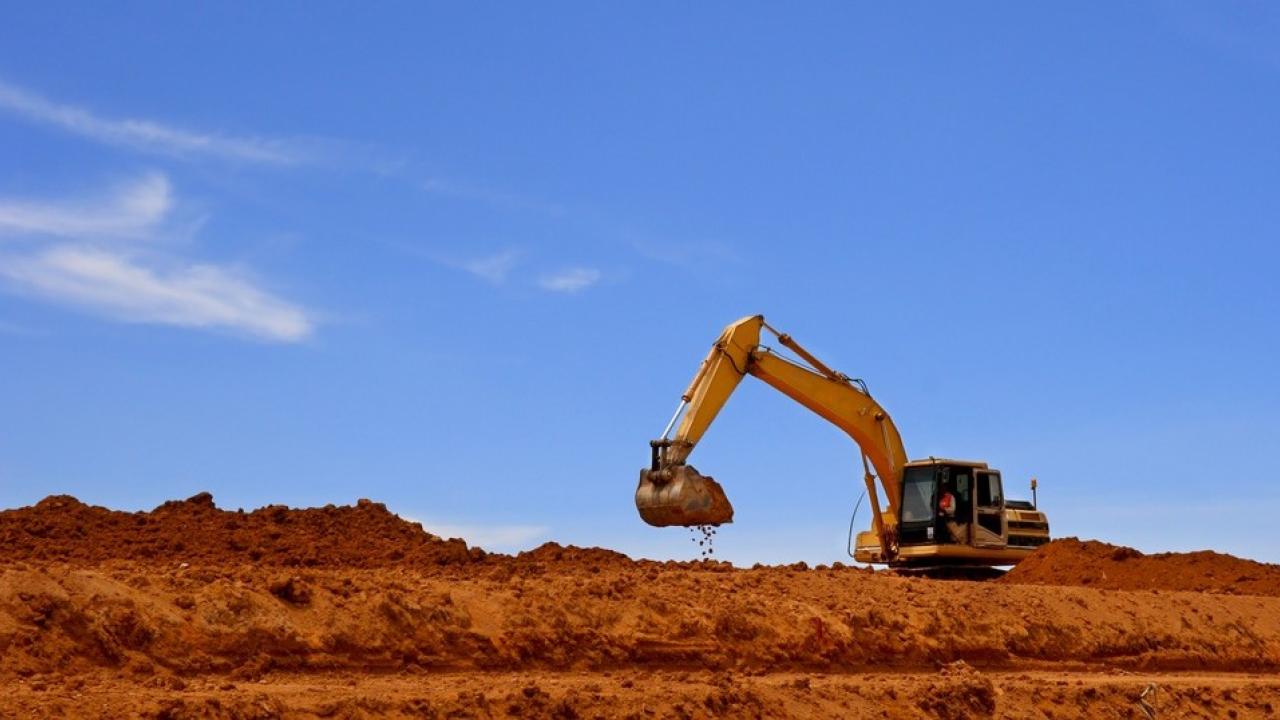 Landscape shot of an excavator digging in soil