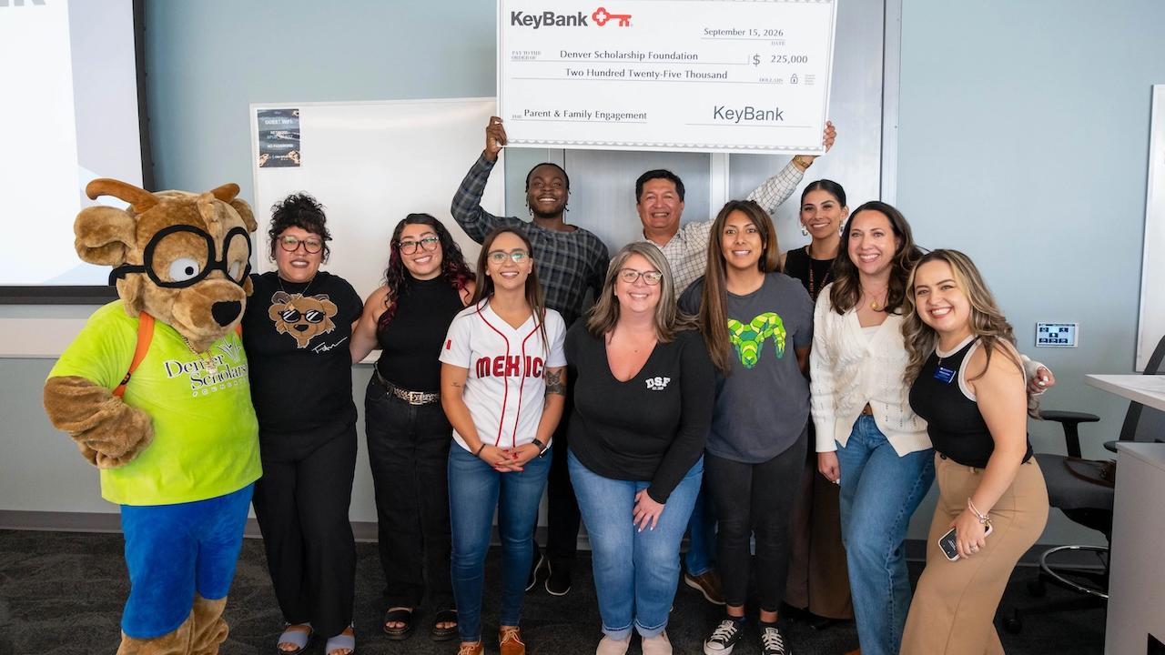 KeyBank and representatives from the Denver Scholarship Foundation shown with a check for $225,000.