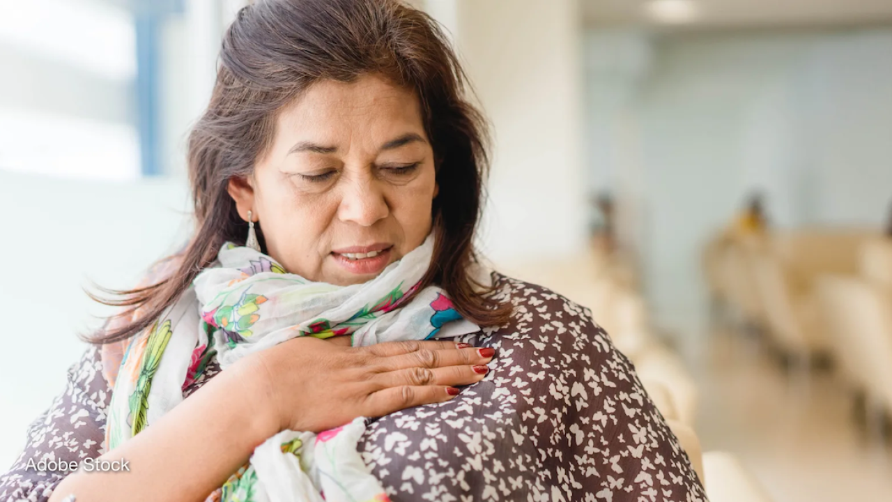 A woman stands in a clinic at a cancer checkup in India. Photo by: Adobe Stock