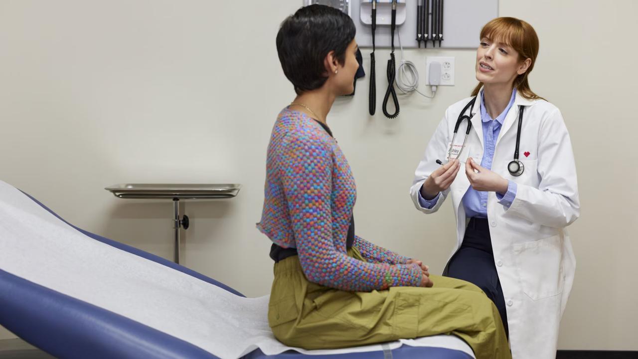 A woman being examined by a female doctor.