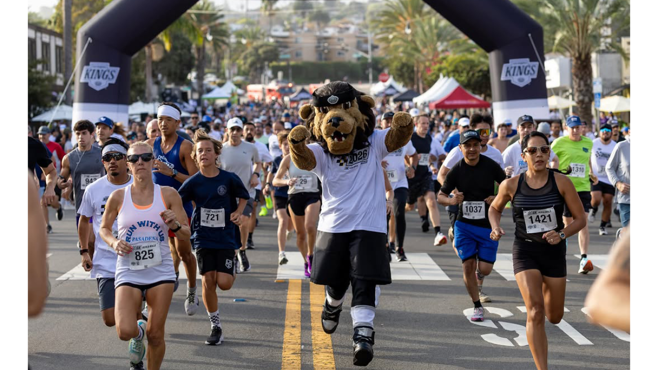 LA Kings Mascot Bailey running with arms pumped up aside runners
