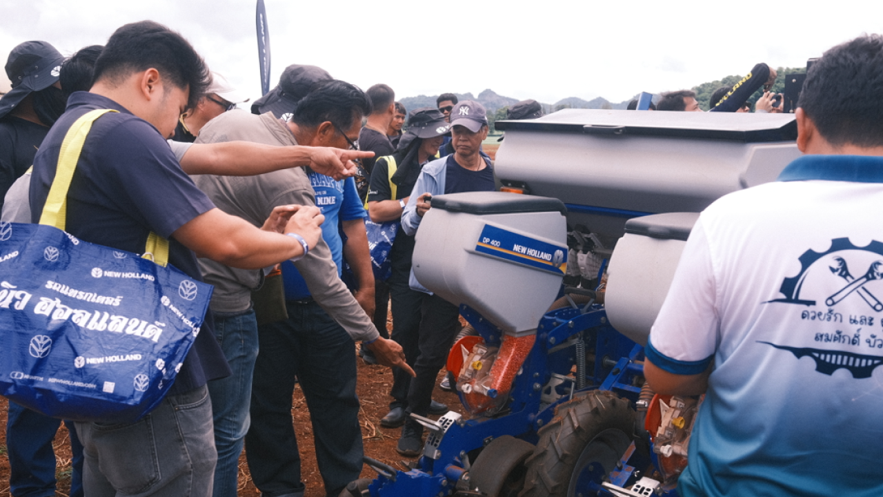 Event attendees checking out farm equipment