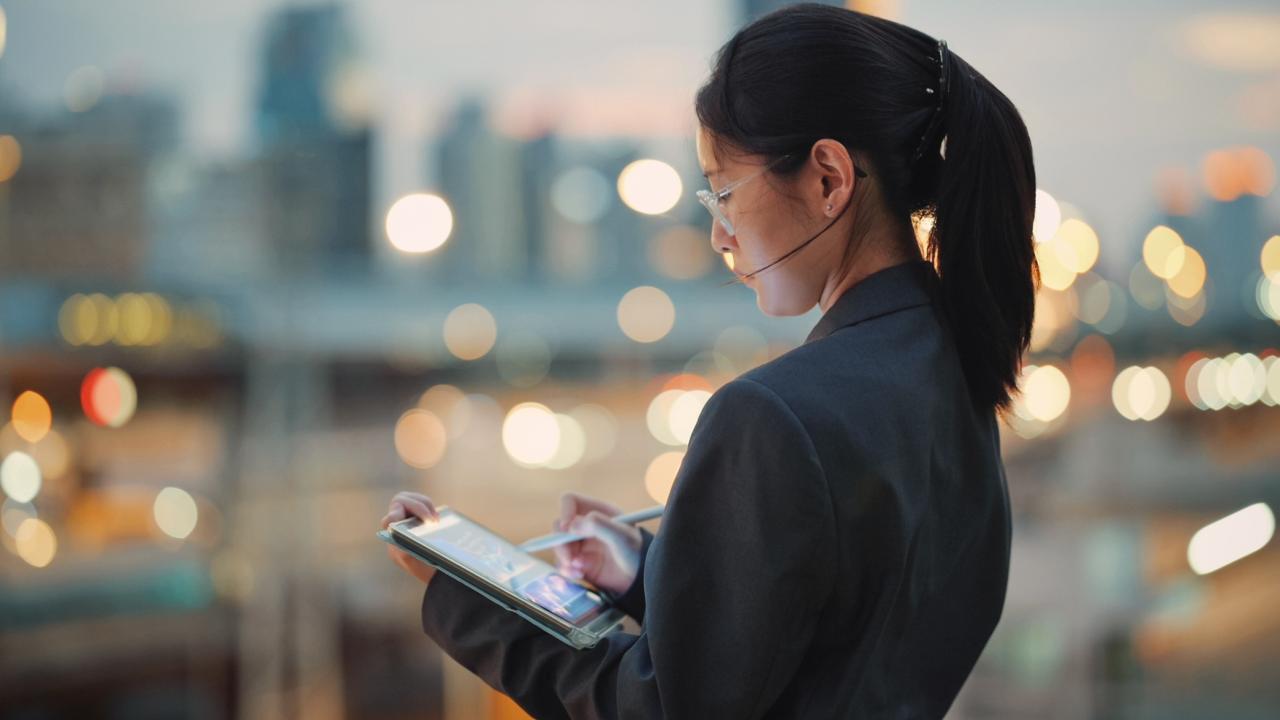 Global investor coding business AI tools on a digital tablet