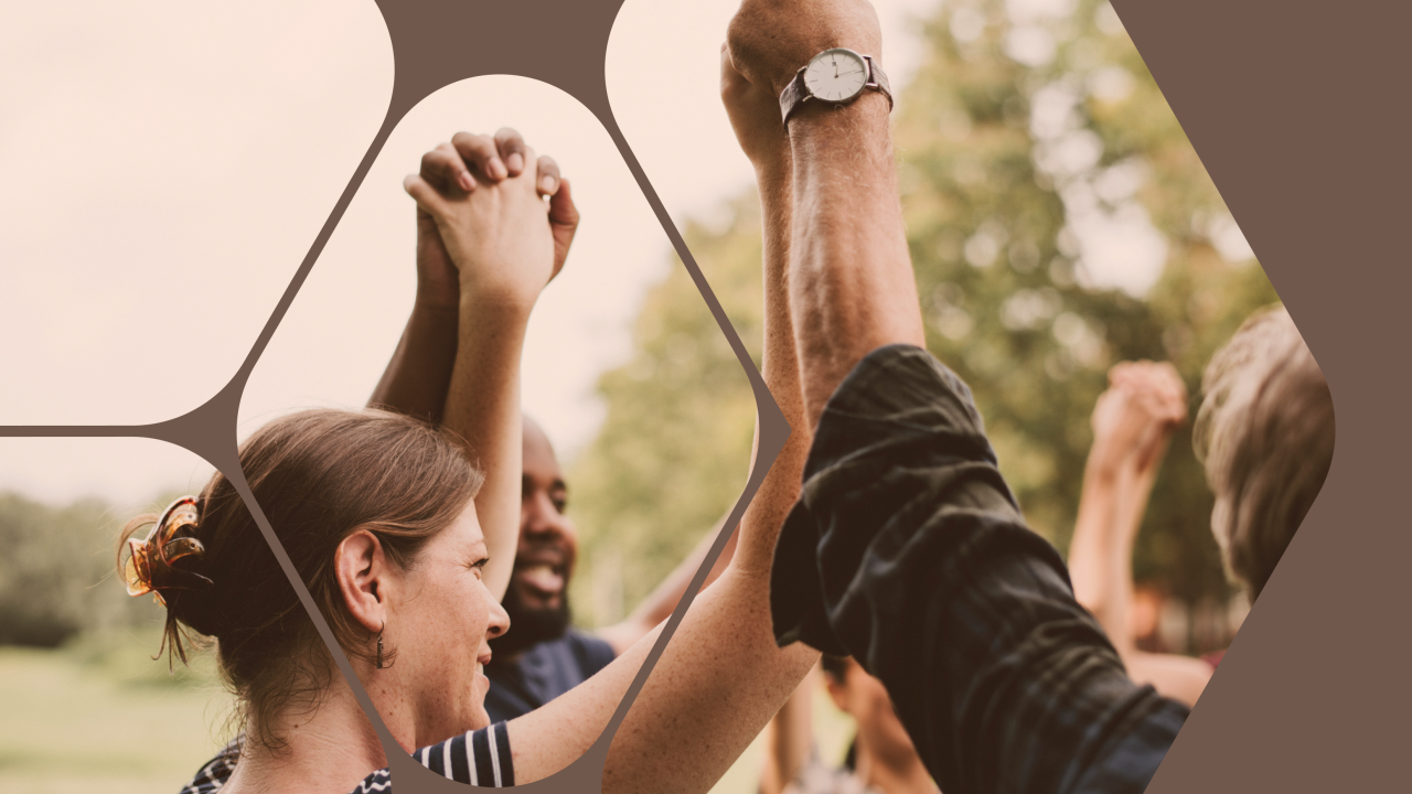 Group holding their hands in the air