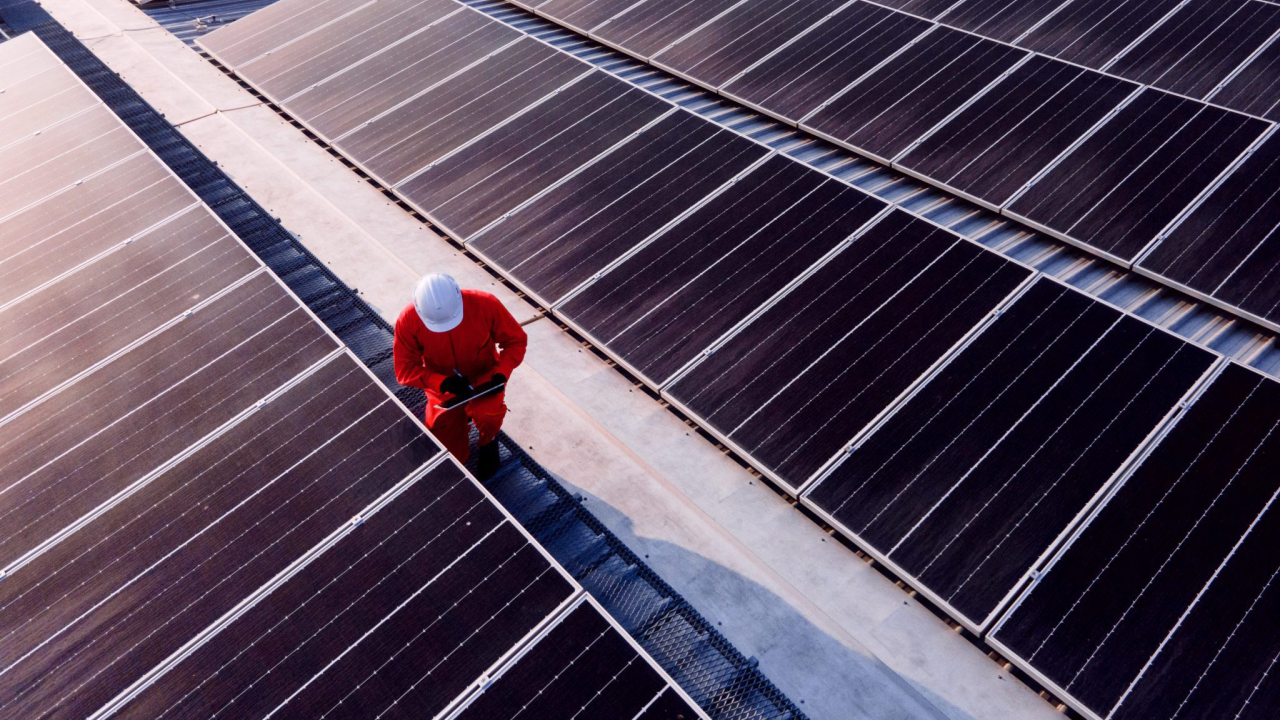 person working on solar panels