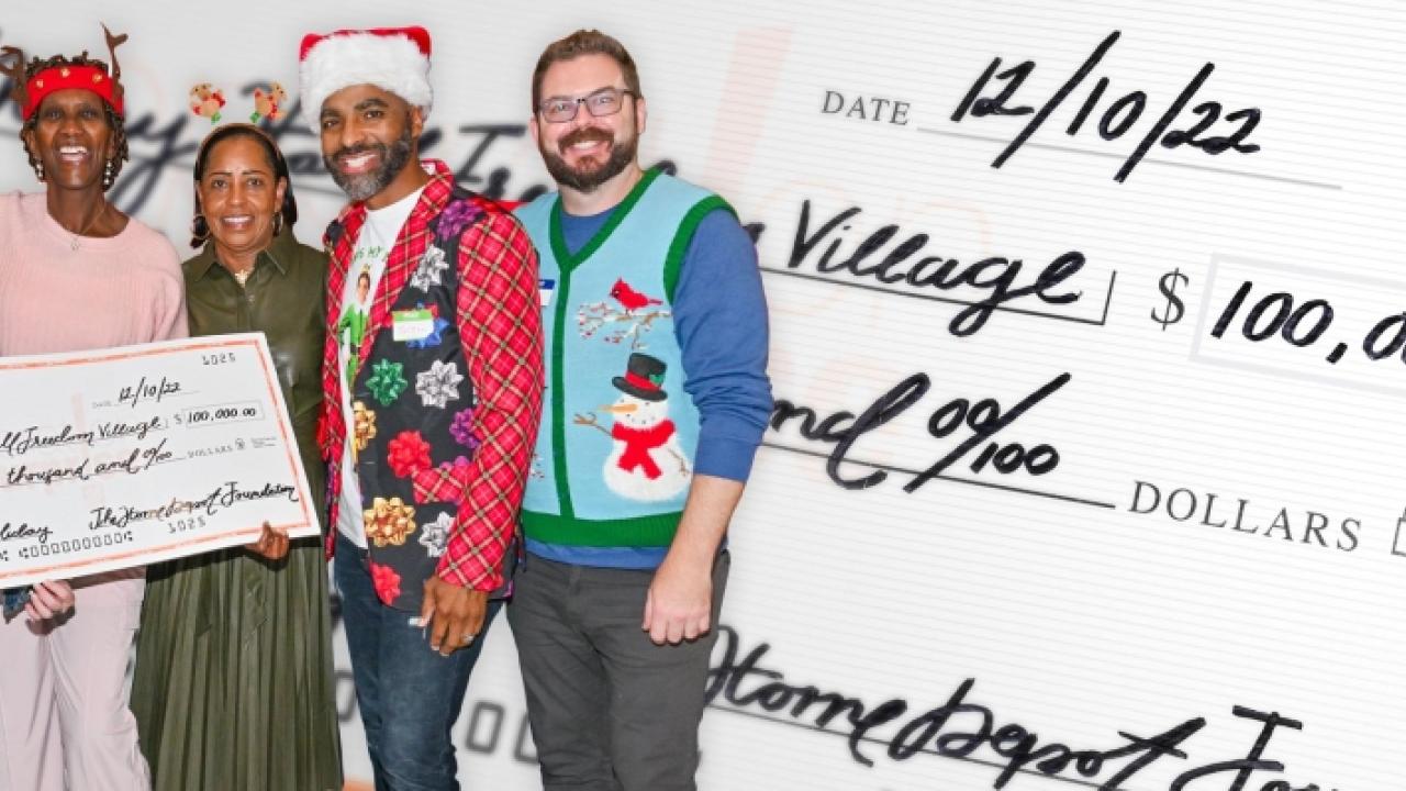 group in festive clothing with an oversized check