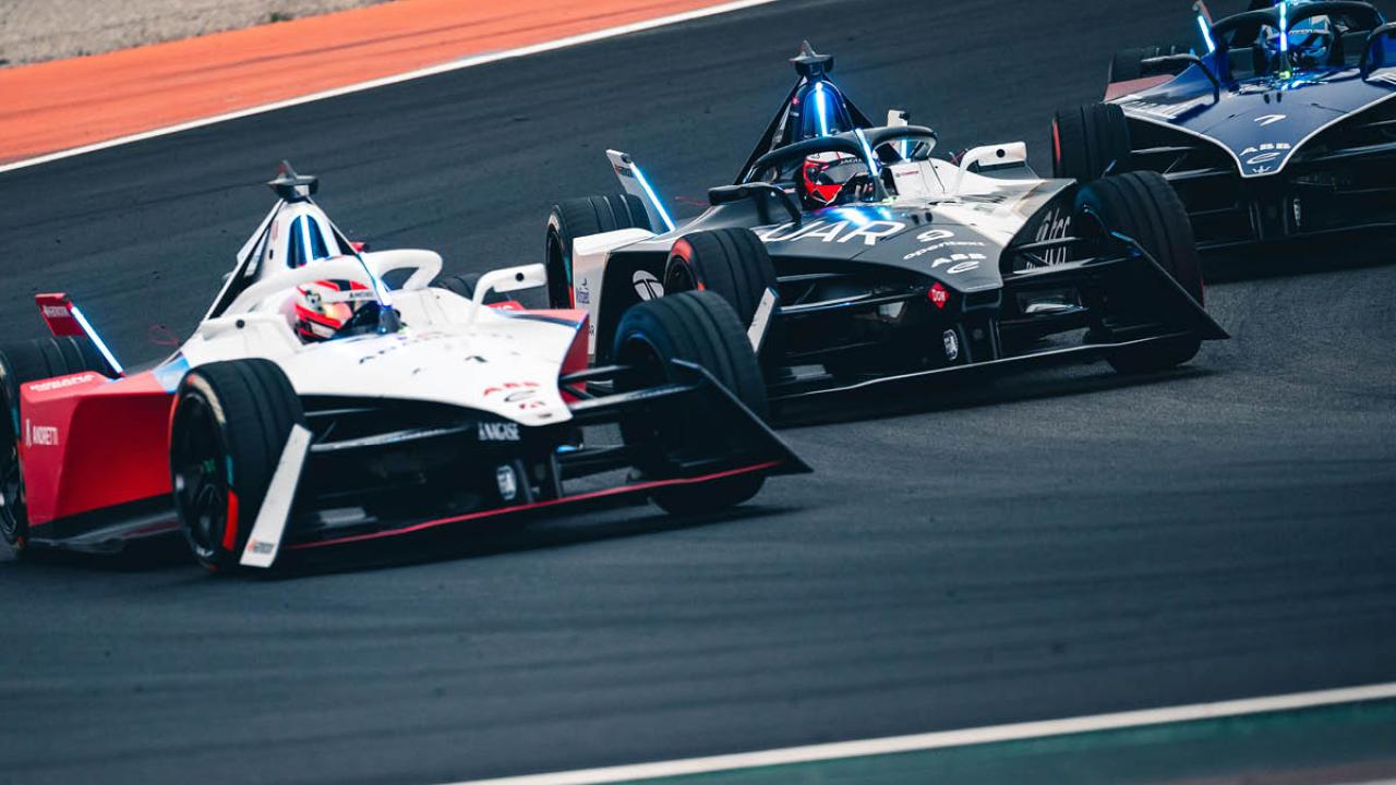 Formula E cars racing on a track